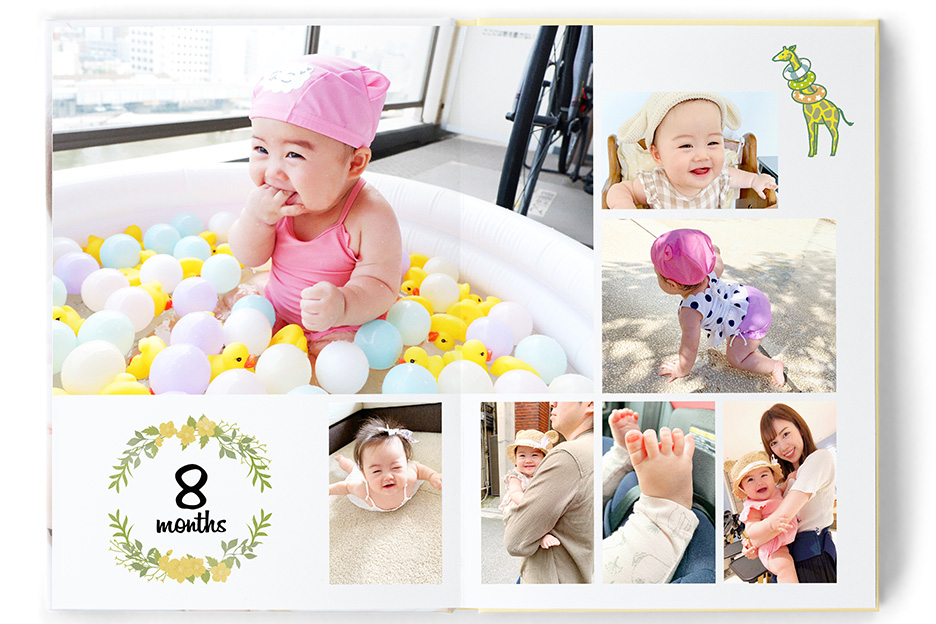 子どもの写真が掲載されたイヤーアルバムの写真